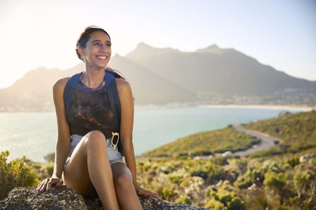 Woman travelling with backpack representing maternal health, wellbeing, and pregnancy support services at Women’s Health Circle